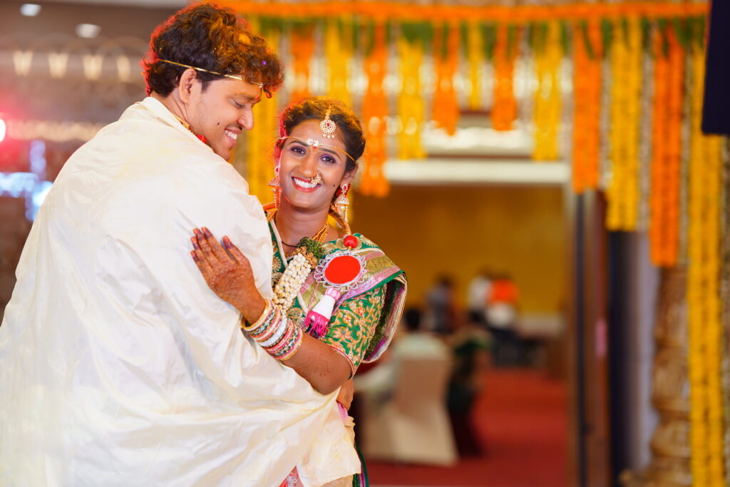 Candid wedding photography hyderabad capturing joyful couple moments during reception celebration