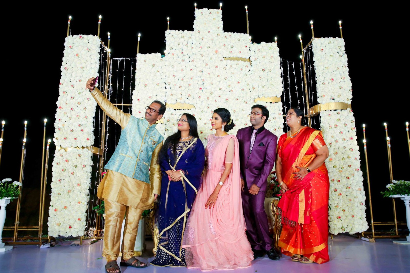 Elegant wedding group photograph at Golconda Fort heritage location in Hyderabad
