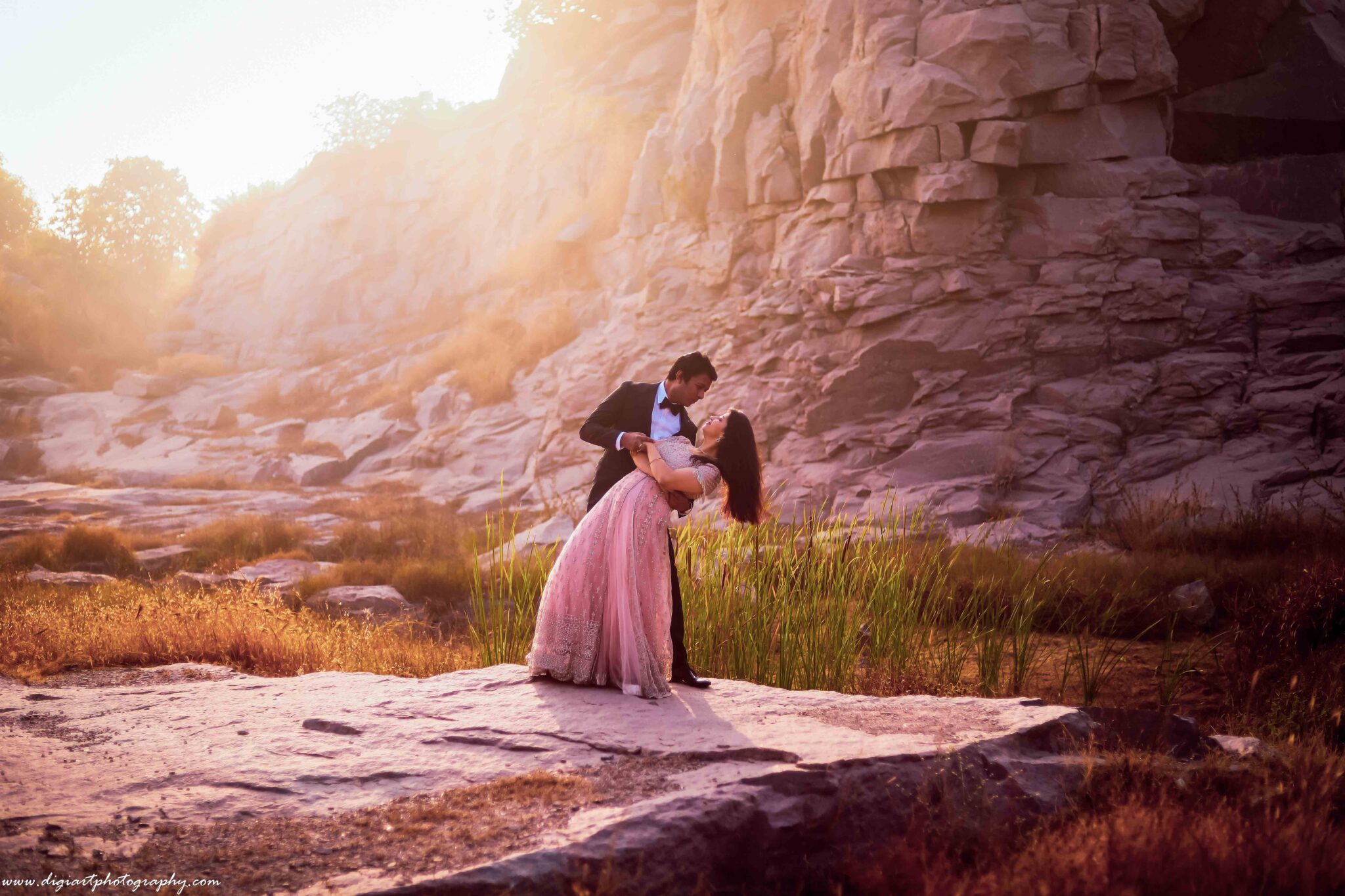 Romantic pre-wedding couple portrait with warm golden hour lighting at scenic Hyderabad location